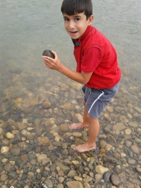 Ibrahim standing in a shallow stream during his years in Çamoluk