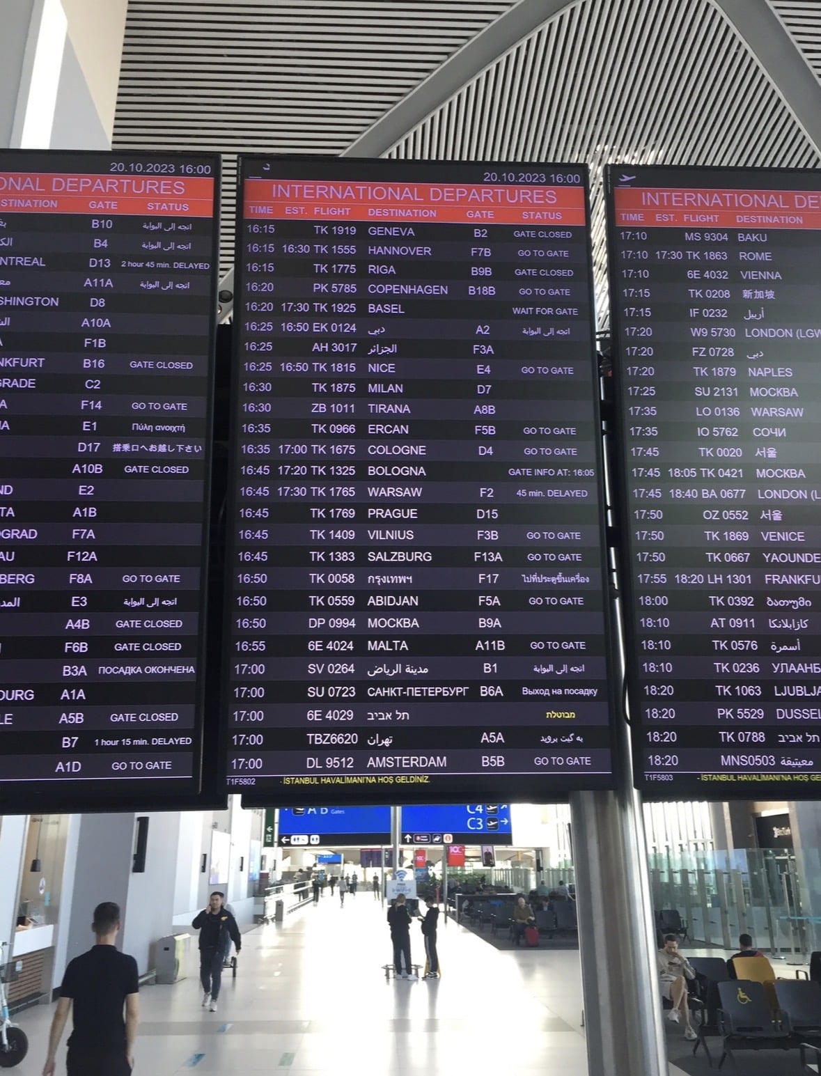 The international departures board showing the Warsaw flight