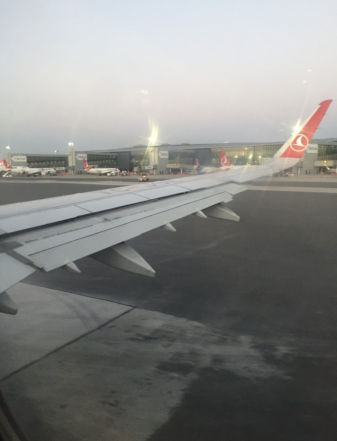 An airplane wing at Istanbul Airport before departure