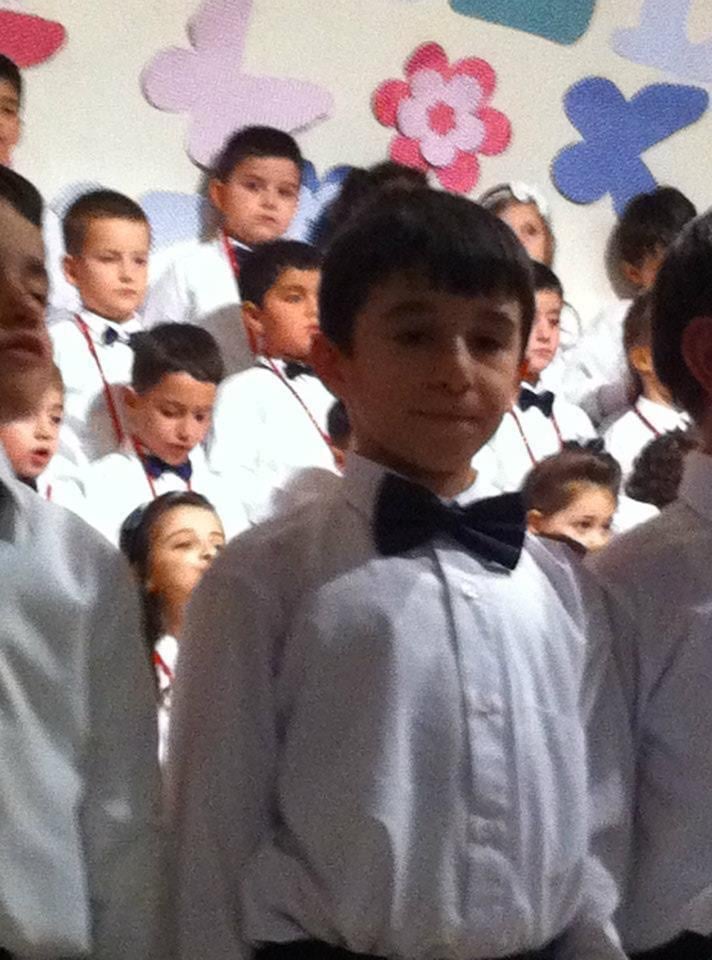 Ibrahim among classmates during a primary school performance