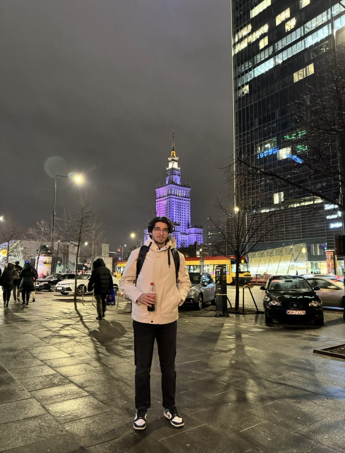 Ibrahim in central Warsaw with the Palace of Culture and Science behind him
