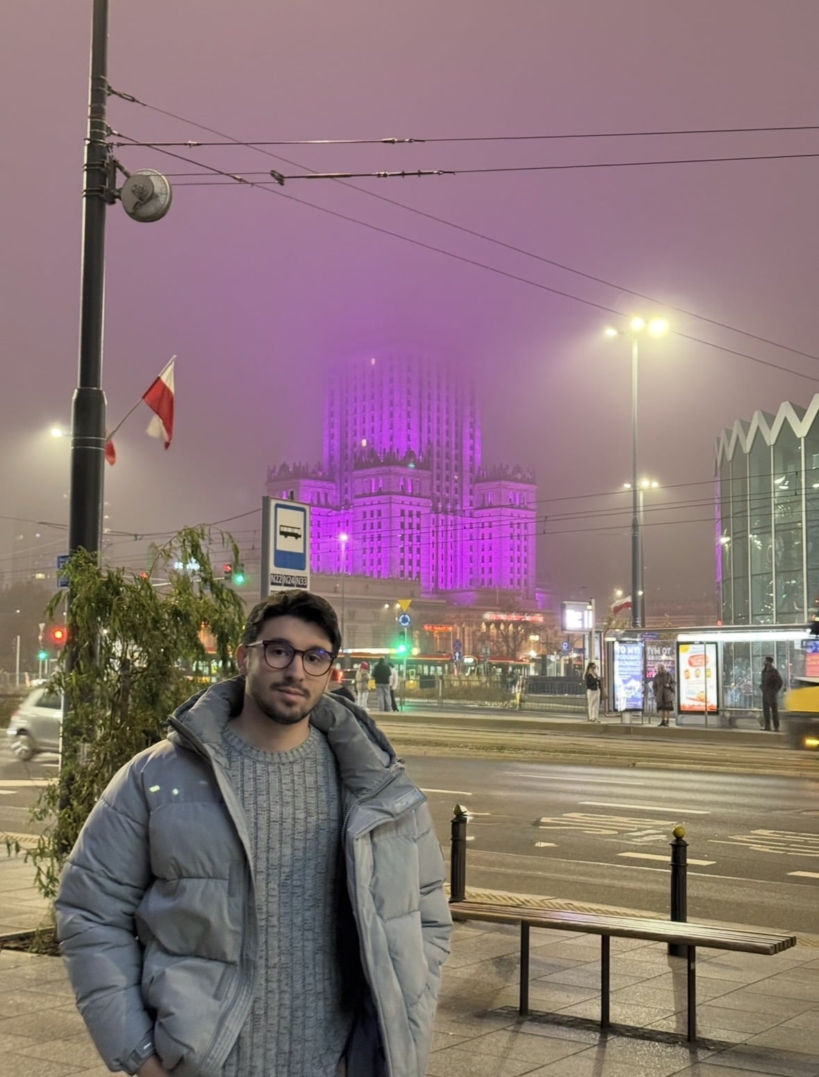 Ibrahim in Warsaw on a foggy evening near the Palace of Culture and Science